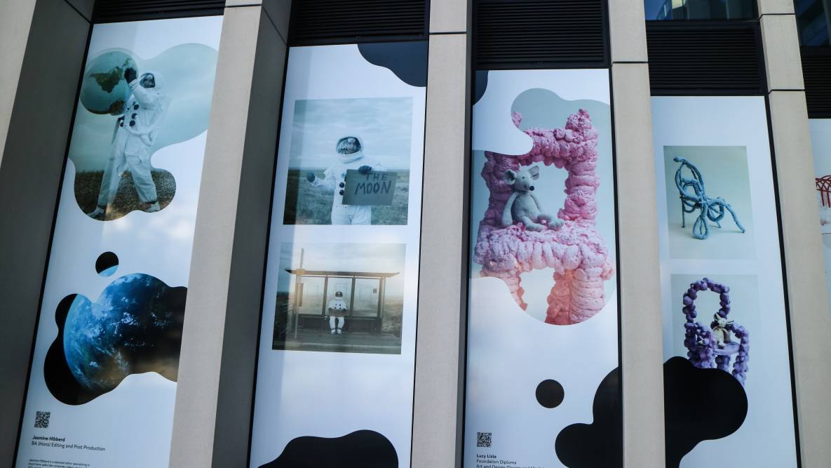 Students' work is displayed on the Ravensbourne building