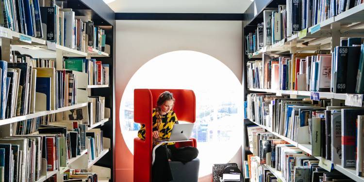 Girl sitting in library