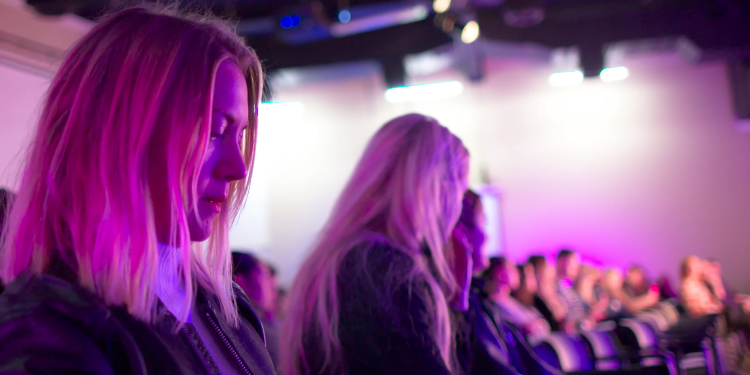 Girl sat in the crowd at an In Conversation event