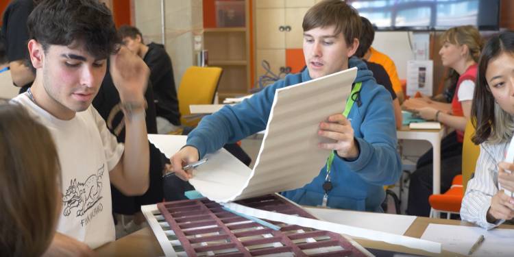 Students inspect materials at Product Design hack