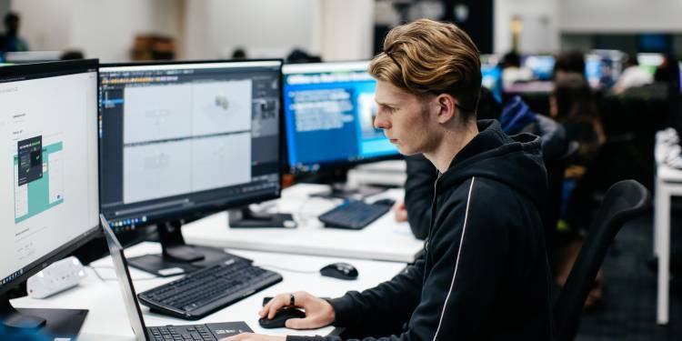 Young man focused on his computer