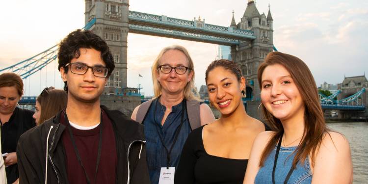 Starpack winners stand on bank of Thames at award ceremony