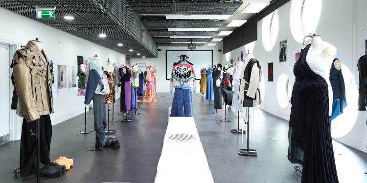 Mannequins in lines dressed in eccentric garments