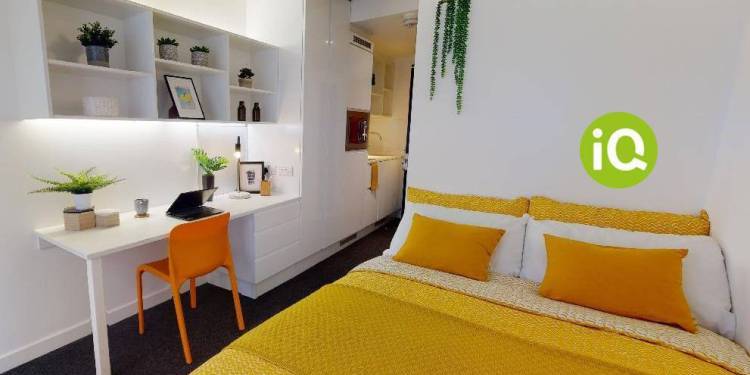 bedroom with a double bed and yellow duvet cover