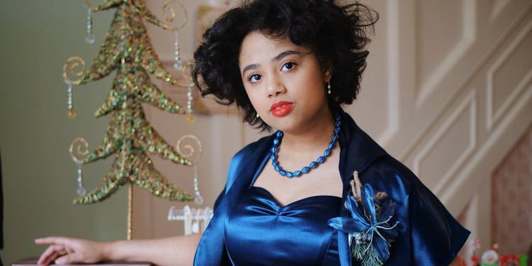 Sumayyah Bailey wearing a vintage blue dress