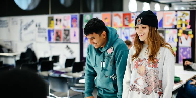 Two students smiling