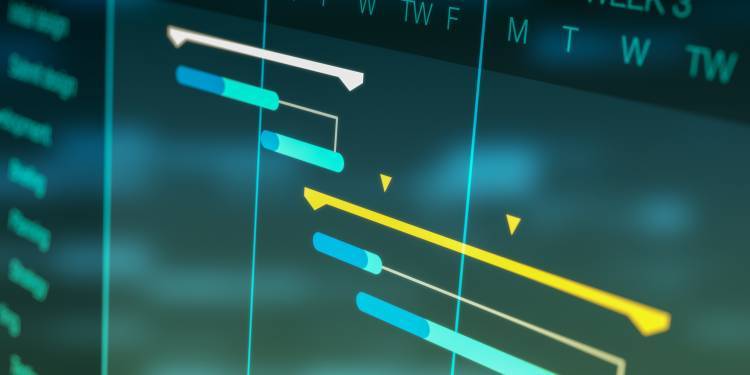 A photograph of a computer screen showing blue and yellow lines under the days of the week