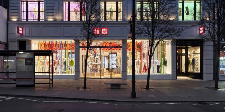 A Uniqlo store at dusk in a grand period building on Oxford Street