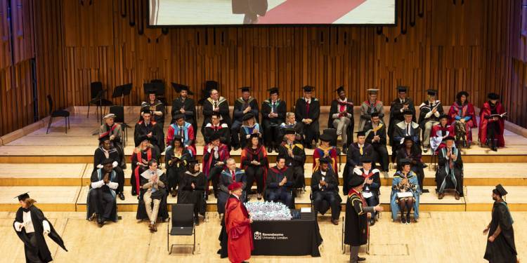 View of procession on stage at graduation