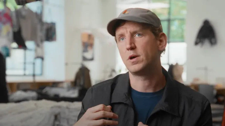 Designer Christopher Raeburn talks to the camera