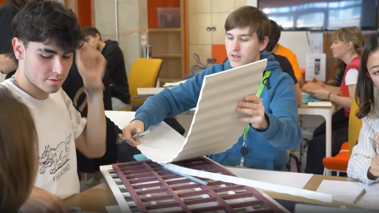 Students inspect materials at Product Design hack