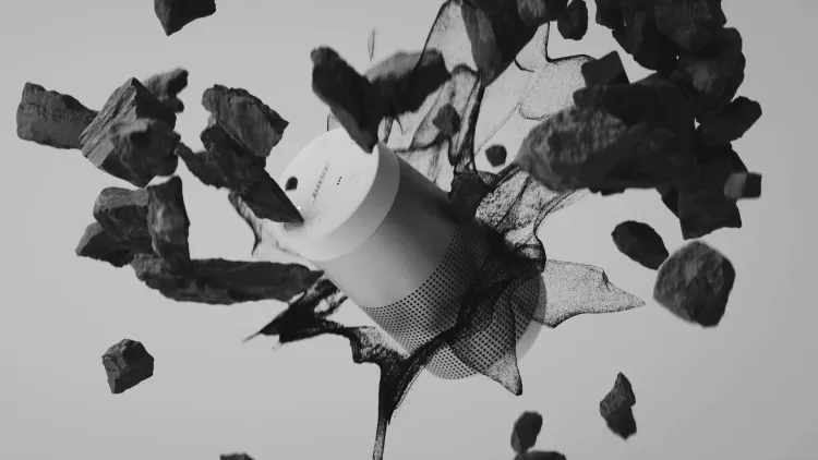 Black and white motion graphics student work with a Bose speaker surrounded by dark rocks