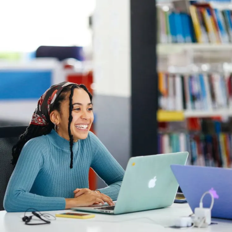 2 students smiling 