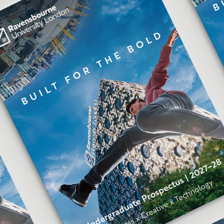Mockup of several Ravensbourne University London Undergraduate Prospectus 2027–28 covers featuring the slogan “Built for the Bold,” a person jumping, and a modern patterned building against a blue sky.