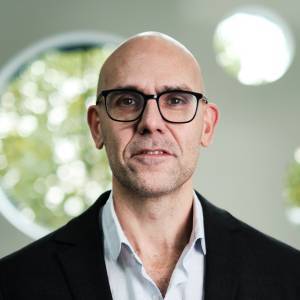 Headshot of a man looking at the camera