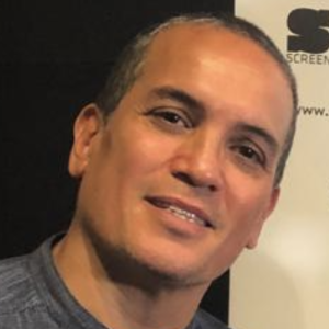 Headshot of a man looking at the camera