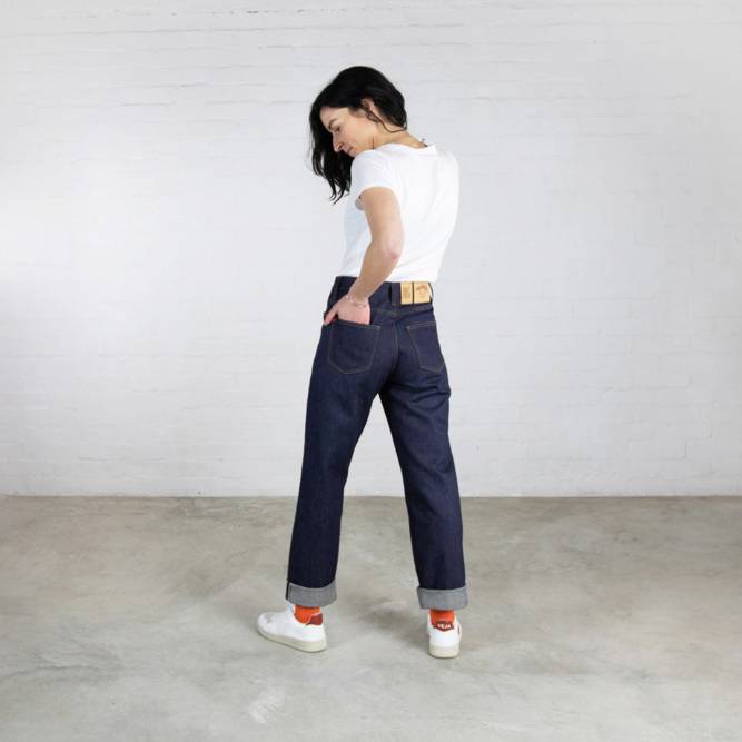 A woman wears jeans from the Clown Hiut Denim collection