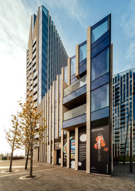 Students' work is displayed on the Ravensbourne building