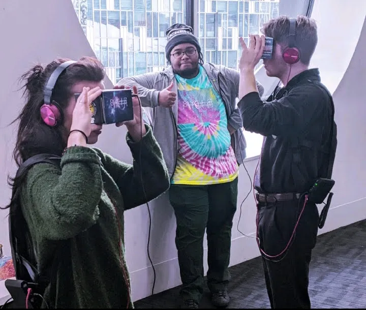 Three people using VR software 