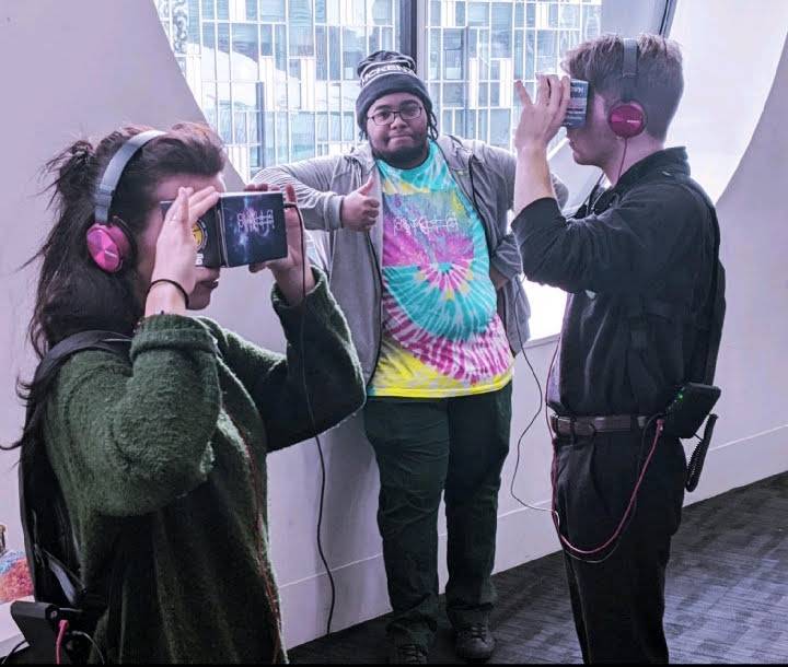 Three people using VR software 