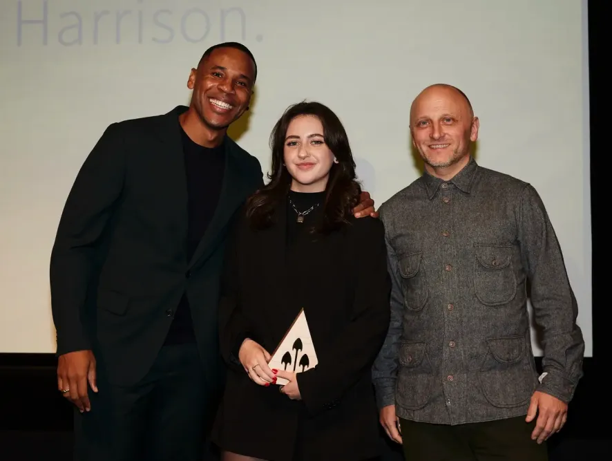 Beth Roberts holds award at Young Arrows