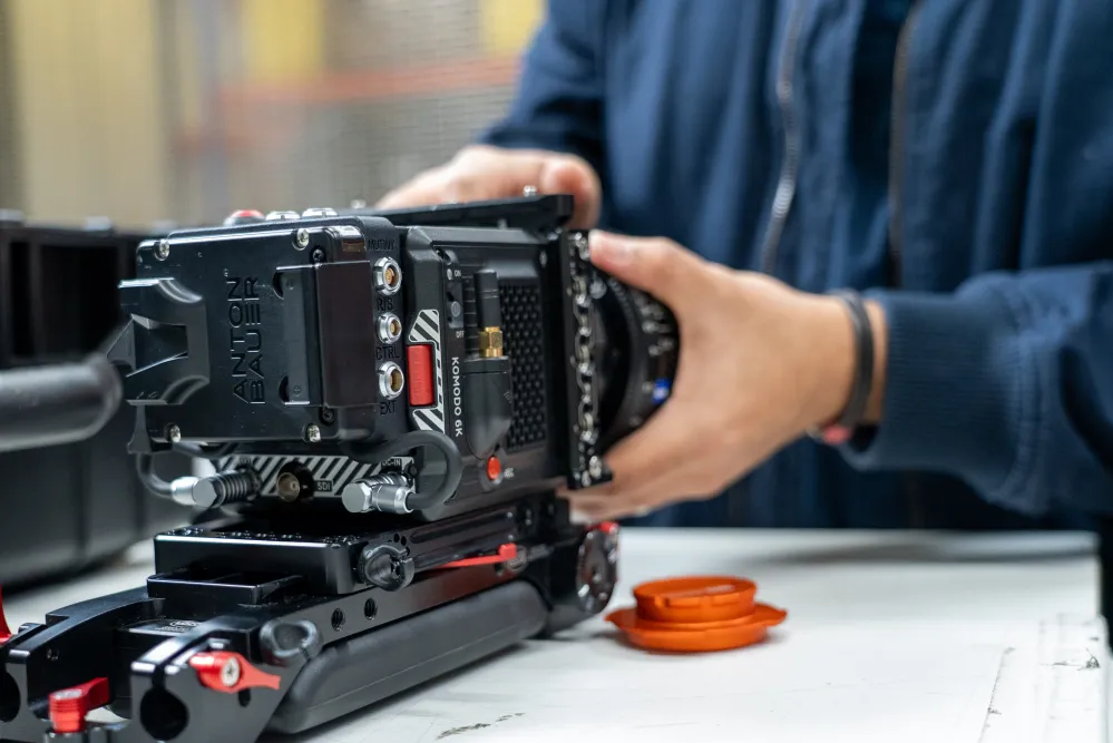Student adjusting a Komodo 6K camera from Ravensbourne's kit store