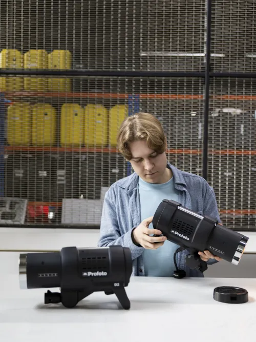 Kit store team member assembling Profoto lighting equipment