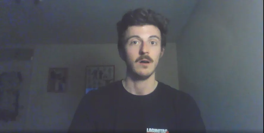 Second year student Keith presents to the camera