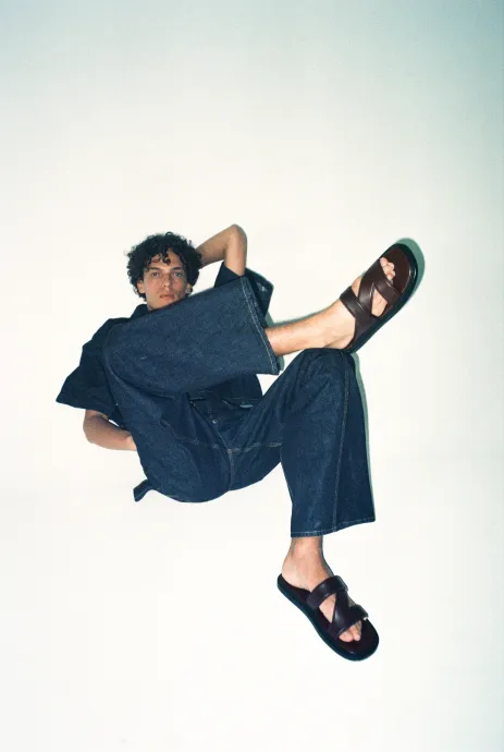 Male model poses against white background