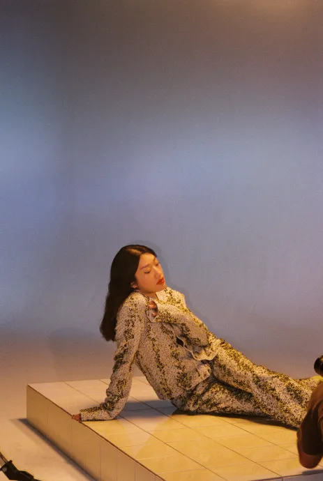 DJ Peggy Gou poses in snake print outfit