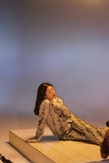 DJ Peggy Gou poses in snake print outfit
