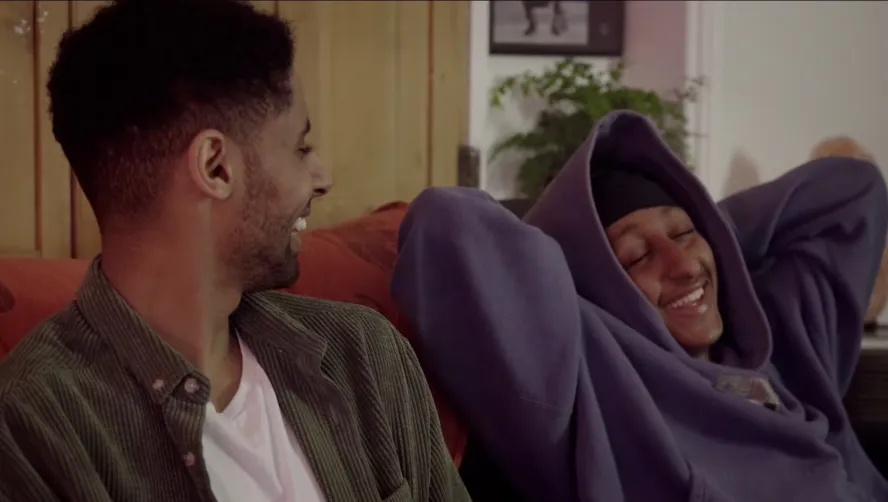 A still from 'His Echo' featuring Leo talking to his friend