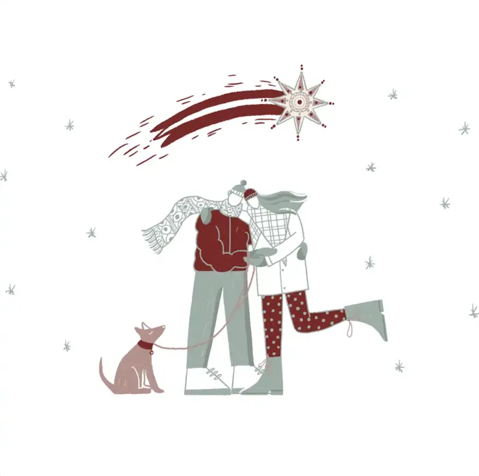 a couple hugging with a dog