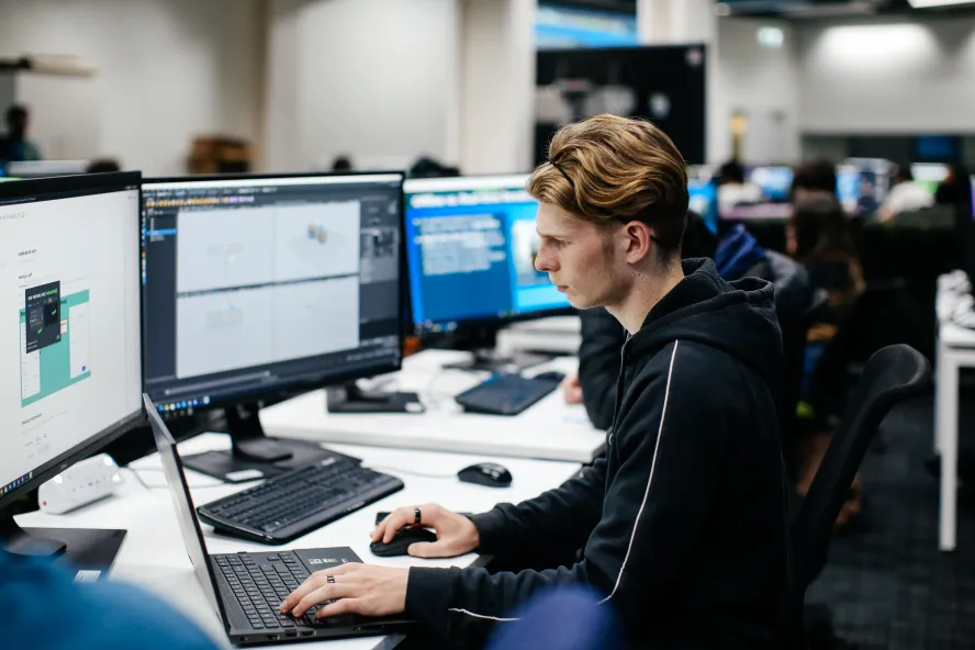 Young man focused on his computer