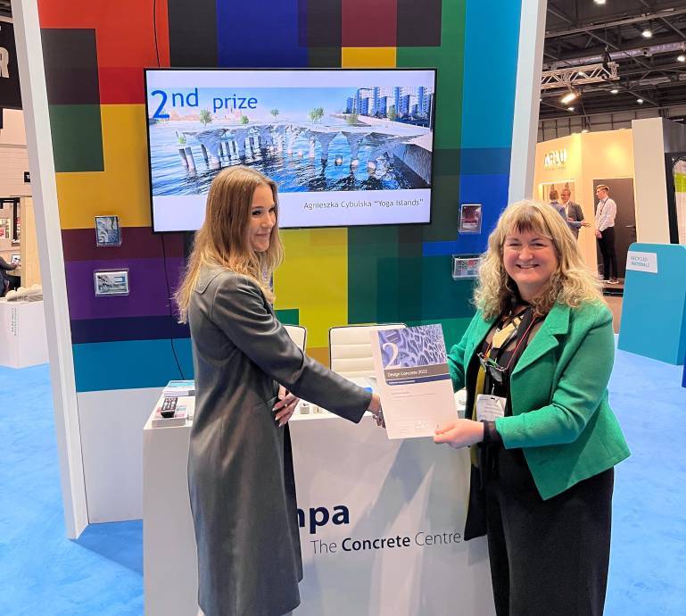 Agnieszka Cybulska receiving the second-place prize in the 2022 Concrete Centre competition
