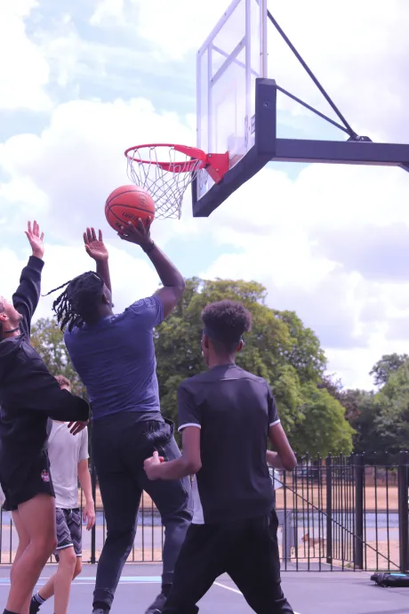 Group of  young men playing basketball 