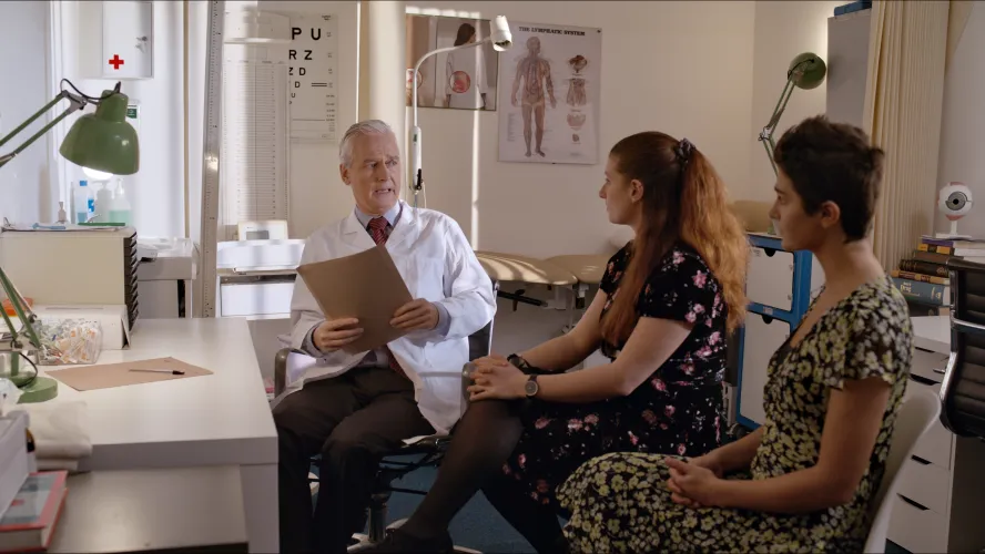 A still from Only Love Matters set in a doctors' office