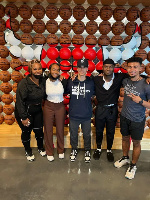 Ravensbourne and US students in front of a display of basketballs at Chicago Bulls HQ