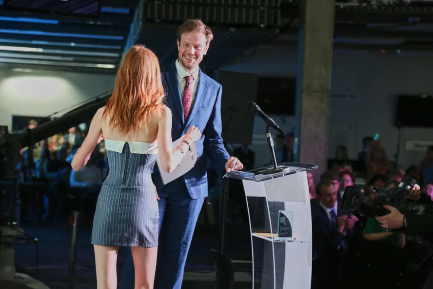 Person collecting award at NaSTA Awards