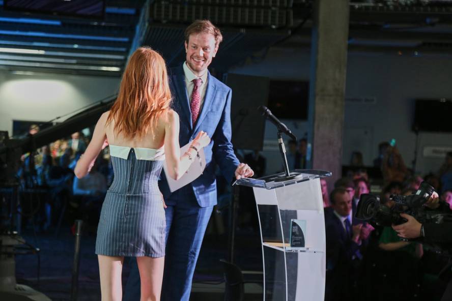 Person collecting award at NaSTA Awards