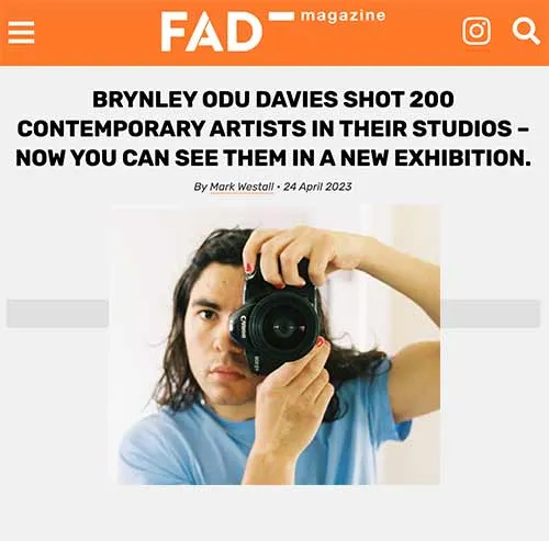 Picture of a news article with a man holding a camera