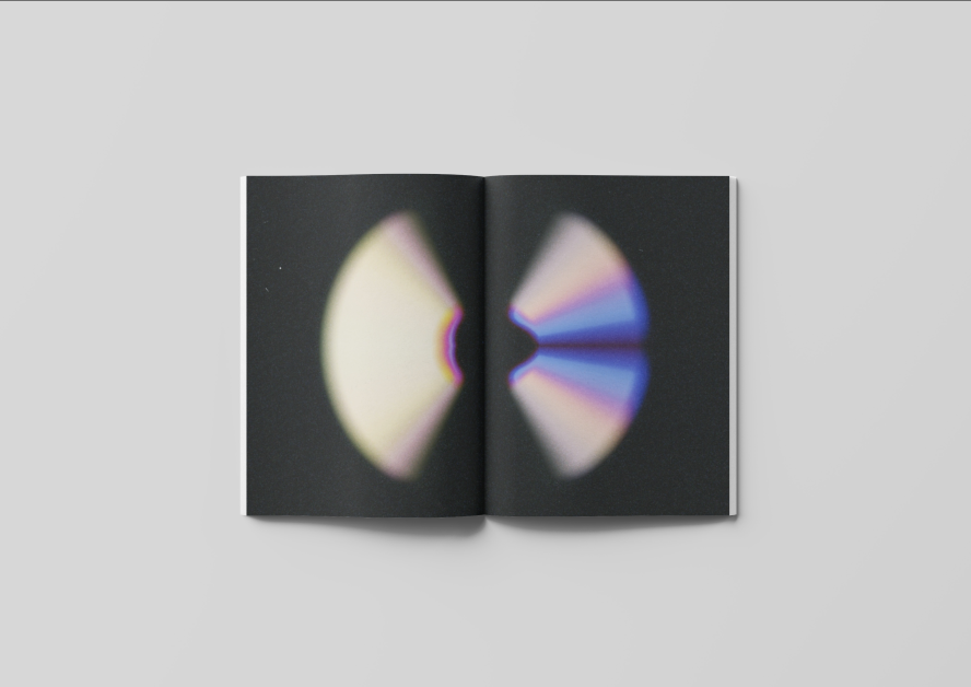 An example of design communication work by Sara Carpiniello. An open book with abstract disc-like shape spanning across the pages.