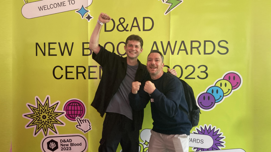 Two students cheer and celebrate at New Blood Awards event