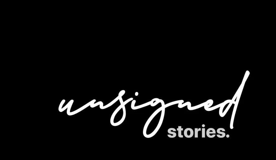 Black background with white writing reads 'unsigned stories' in cursive text