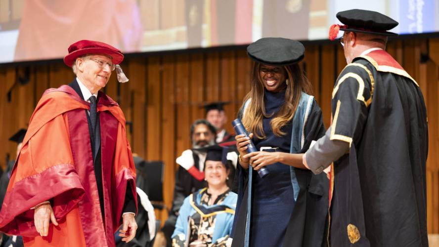 Honorary doctorates June Sarpong and Misan Harriman on stage at graduation