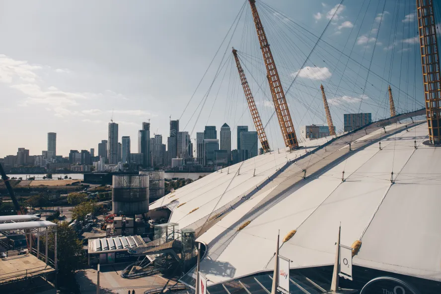 Aerial view of the O2 Arena with Canary Wharf in the background