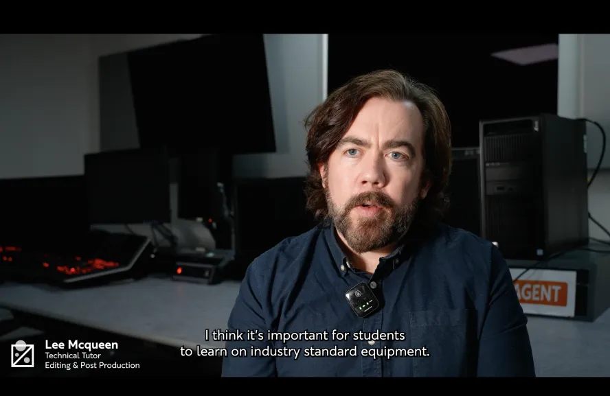 Technical tutor at Ravensbourne University being interviewed in an editing and post production suite