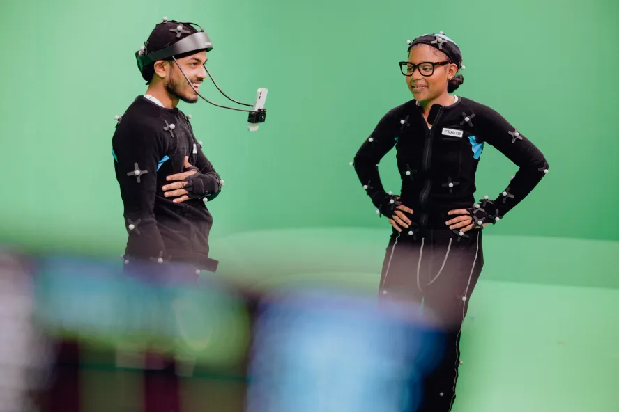 Students wearing motion capture suits and camera equipment in Ravensbourne's Centre of Excellence in Emerging Technology