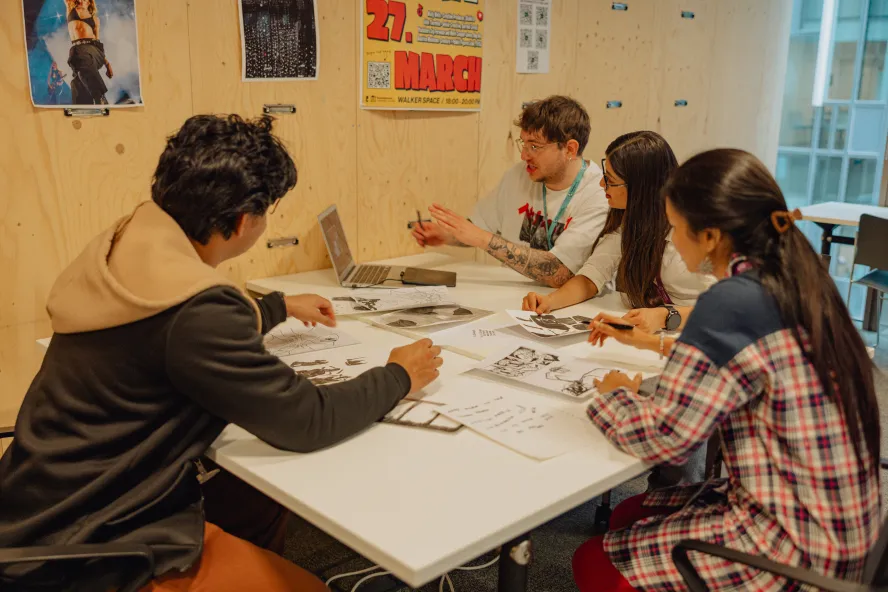 Design students working on a group task in R3 study space at Ravensbourne University