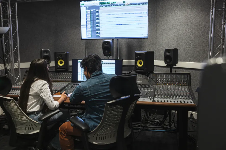 Students in a sound studio working together